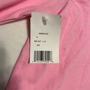 A medium pink vans cropped long sleeve shirt!